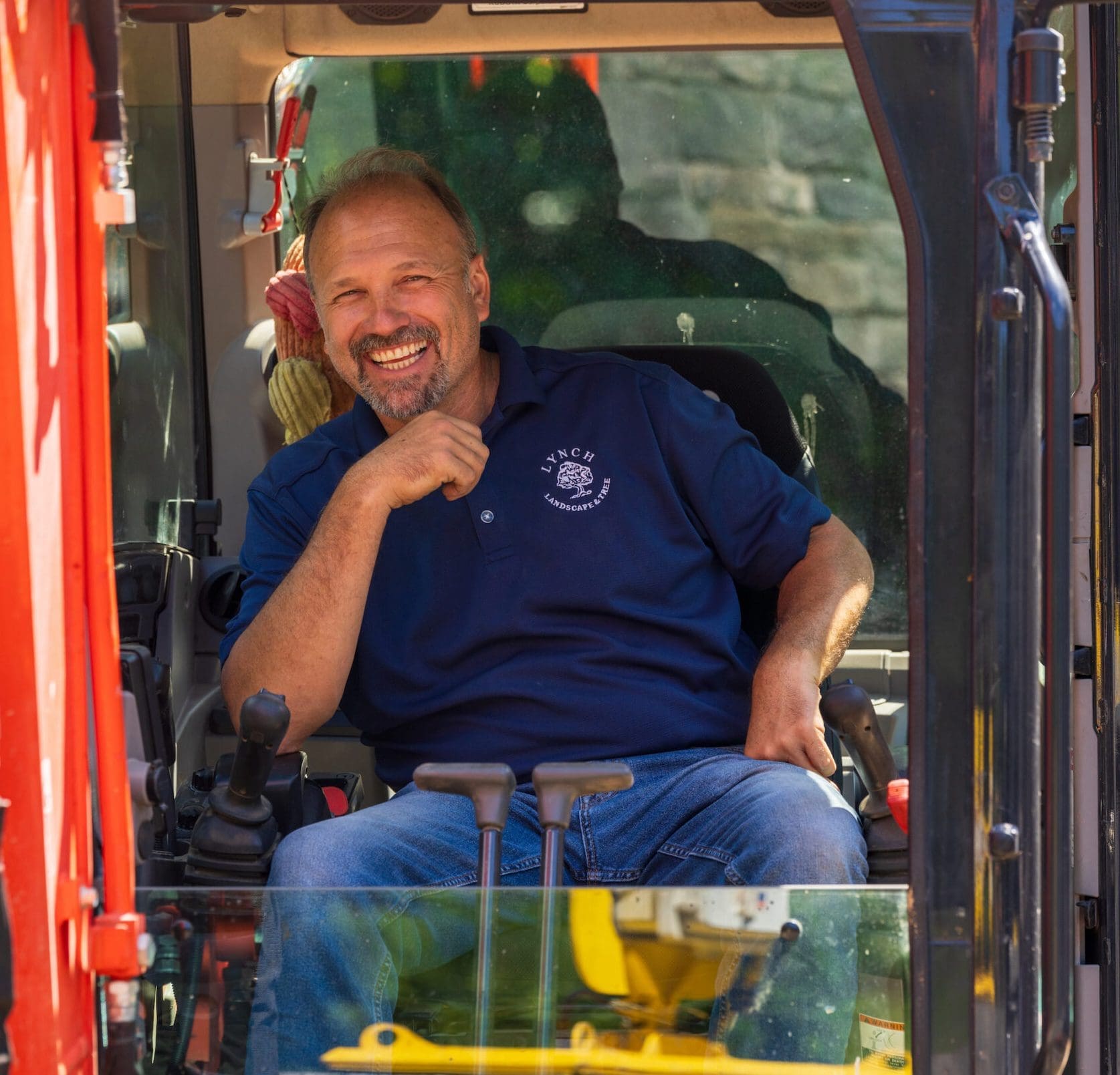 Landscape manager from Lynch landscape and tree service in Sudbury on the job.