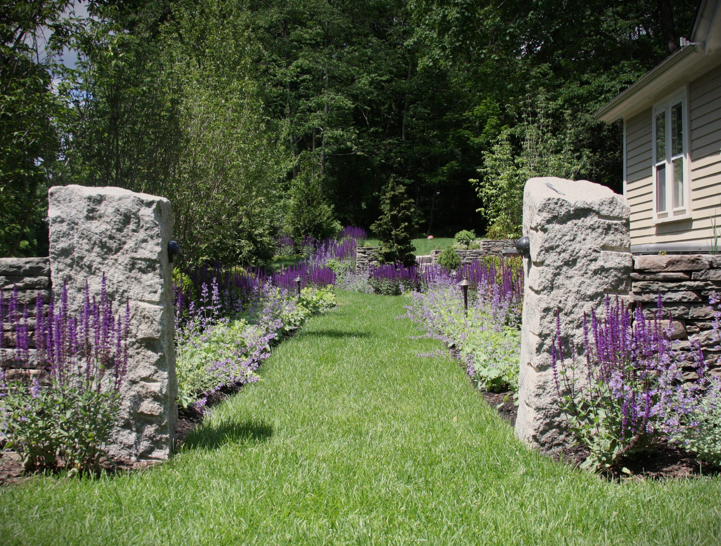 stone masonry, lawn care, and fine gardening example by Lynch Landscaping.