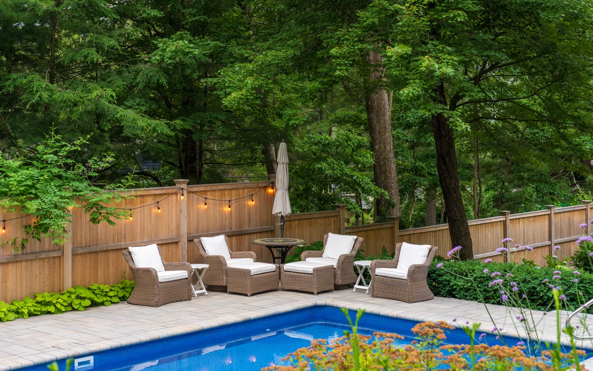pool landscape design in massachusetts with custom lighting and fine gardening